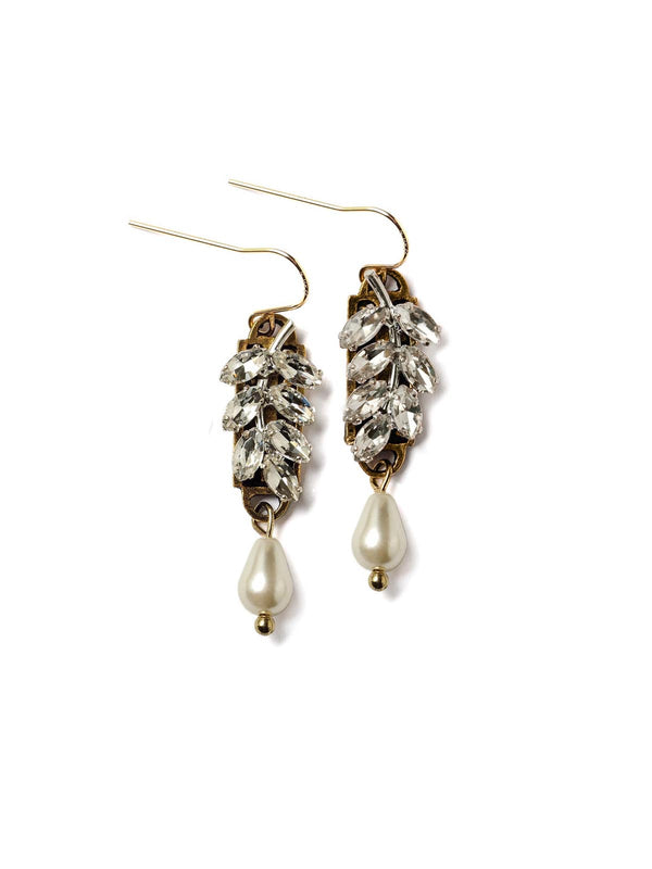 top down view of a pair crystal laurel earrings with pearl drops