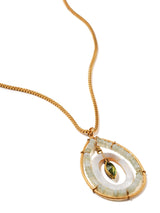 close up of beaded teardrop shaped pendant on box chain in bright gold