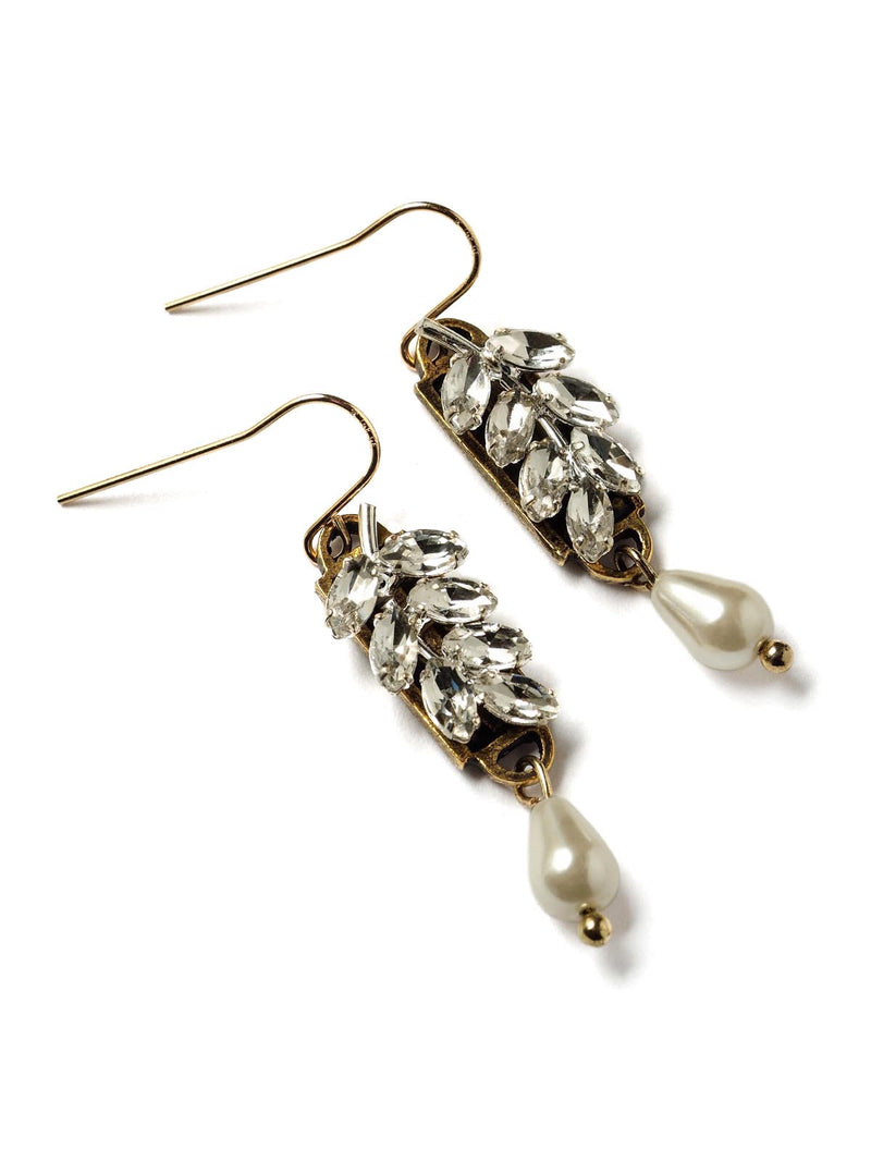 a side view of a pair of crystal laurel earrings with pearl drops