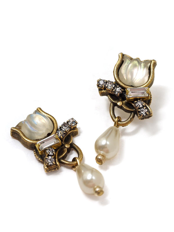 close-up view of sparkling earrings with glass tulips and pearls